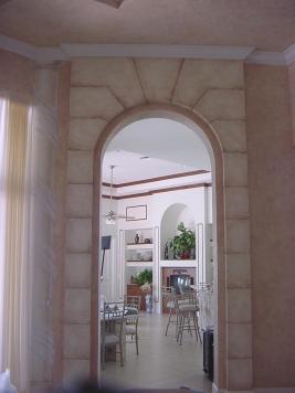 Faux stones accent a grand archway