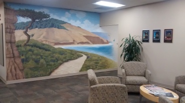 An idyllic image of Torrey Pines creates a calm ambiance in this San Diego office - https://jcfsandiego.org/