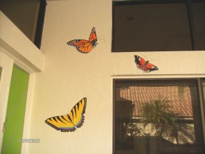 Realistic butterflies greet visitors by this entryway